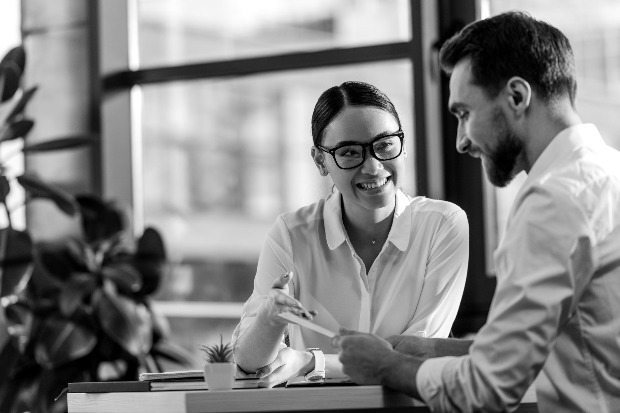 Two Fortis advisors reviewing a plan at a desk